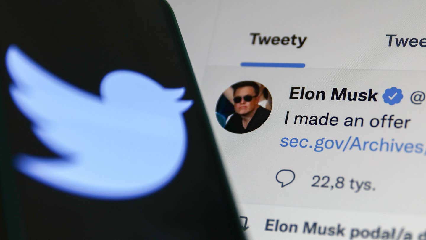 Elon Musk's Tweet displayed on a screen and Twitter logo displayed on a phone screen are seen in this illustration photo taken in Krakow, Poland on April 14, 2022. (Photo illustration by Jakub Porzycki/NurPhoto via Getty Images)