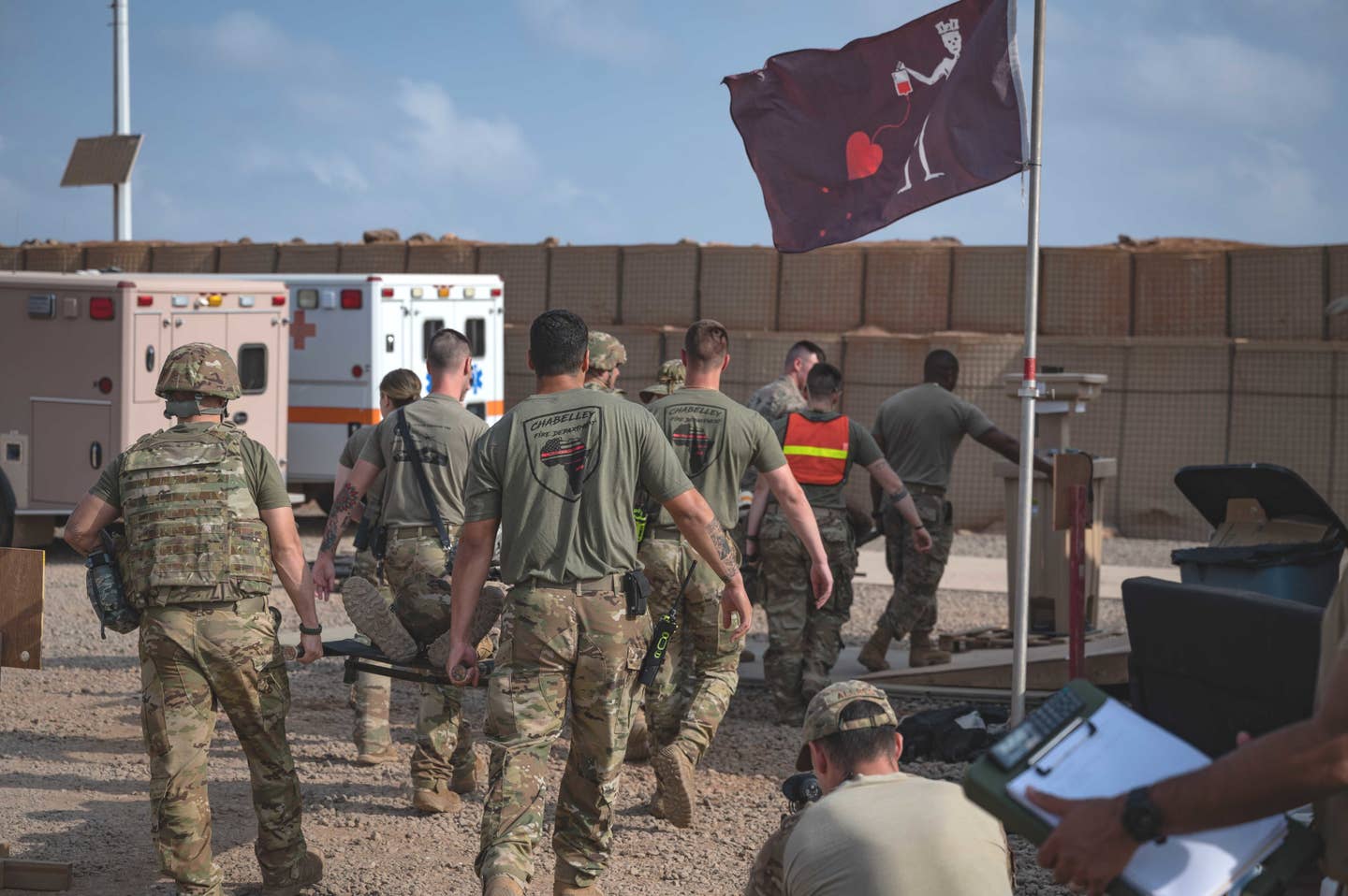 U.S. service members supporting Combined Joint Task Force-Horn of Africa tend to simulated casualties during a mass casualty exercise at Chabelley Airfield, Djibouti on April 21, 2022. <em>U.S. Air Force photos by Staff Sgt. Joel Pfiester</em>
