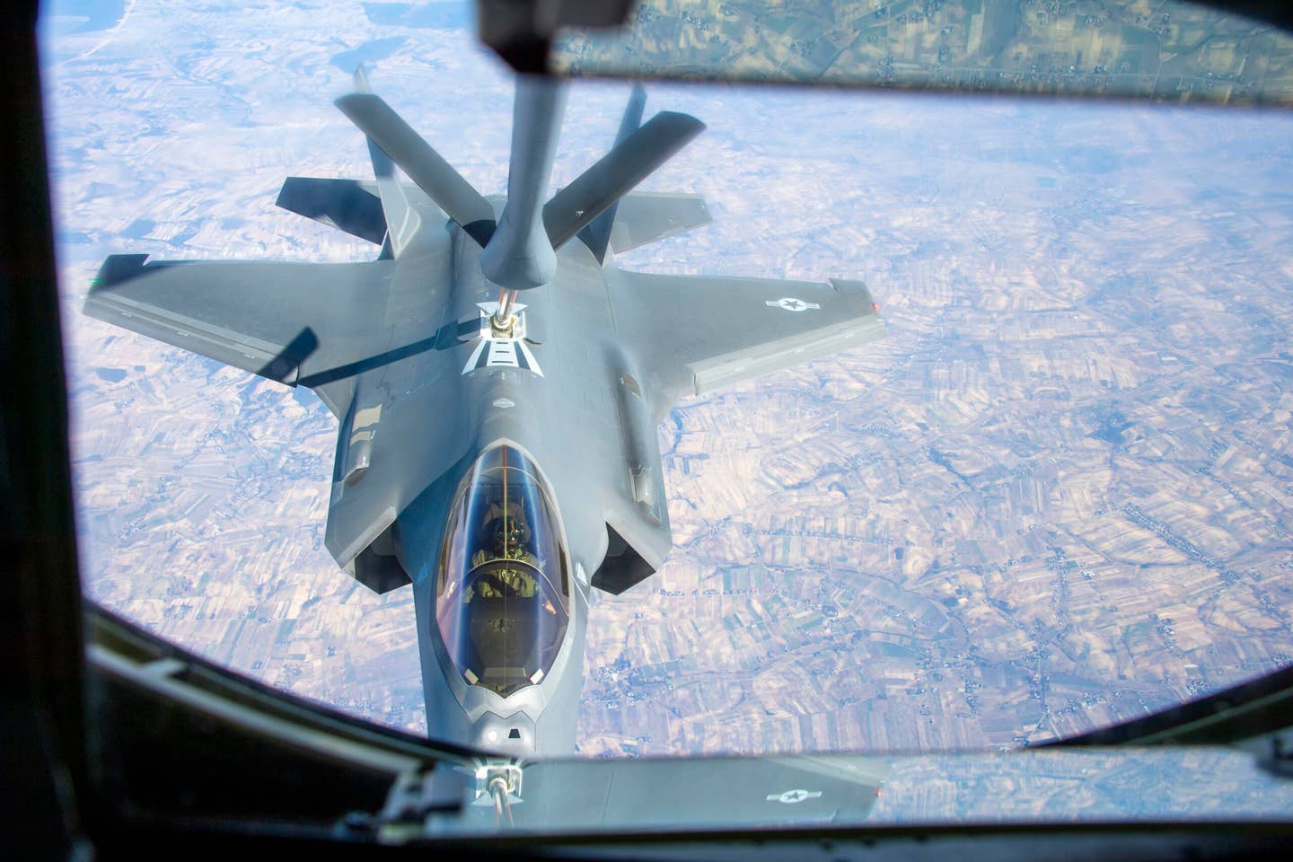An F-35A assigned to Hill Air Force Base, Utah, latches on to a boom to receive fuel from a KC-135 Stratotanker, March 22, 2022. <em>U.S. Air Force photo by Airman 1st Class Jessica Sanchez-Chen</em>