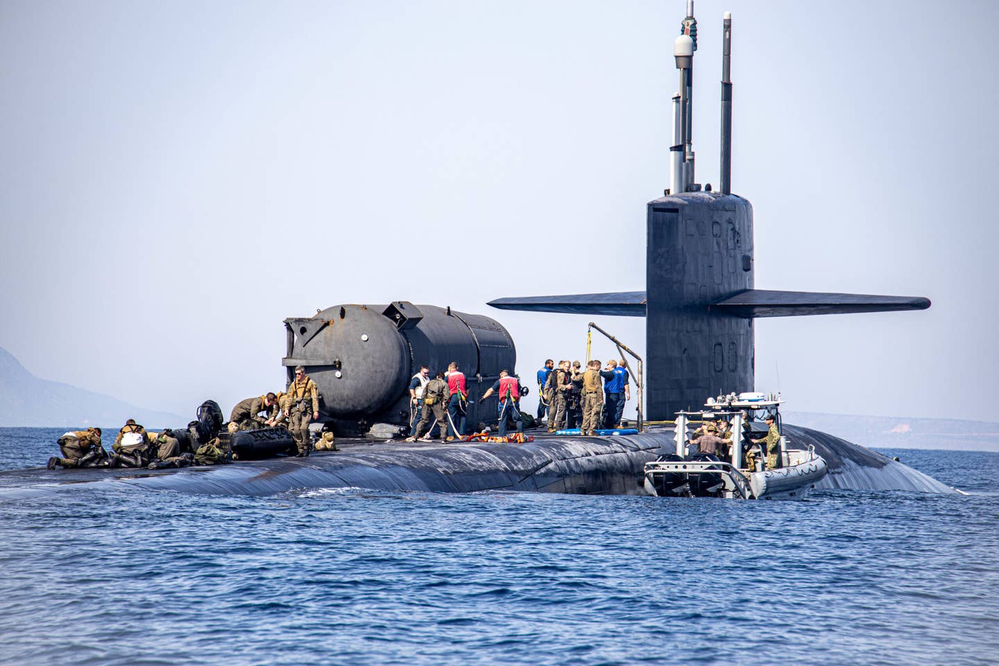 SOUDA BAY (March 27, 2022) – The <em>Ohio</em> class guided-missile submarine USS <em>Georgia</em> (SSGN 729) near Souda Bay, Greece, during training with U.S. Marines from Task Force 61/2 (TF-61/2), conducting launch and recovery training with their combat rubber raiding craft, March 27, 2022. (U.S. Marine Corps photo by Sgt Dylan Chagnon/Released)