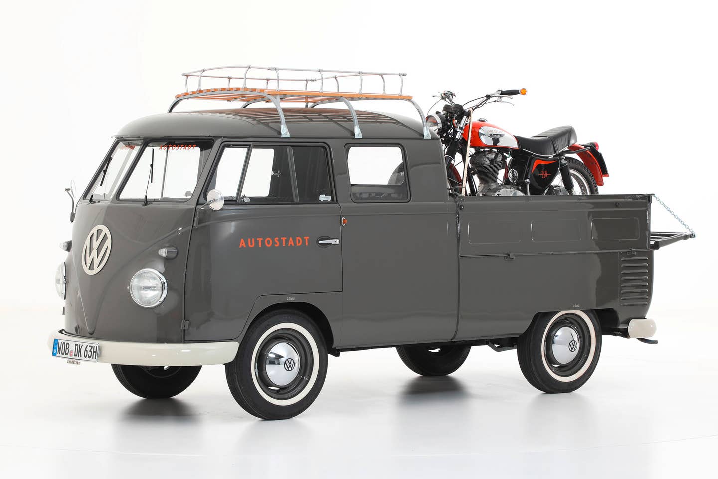A Volkswagen Type 261 (1965) and Ducati Scrambler 350 (1973) of Autostadt’s historical car collection. The Type 2 VW Bus came in a variety of pickup configurations. Credit: VW