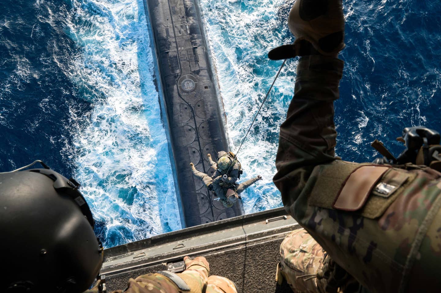 Special operators being winched onto an SSGN in the Mediterranean. (Credit: USSOCOM)