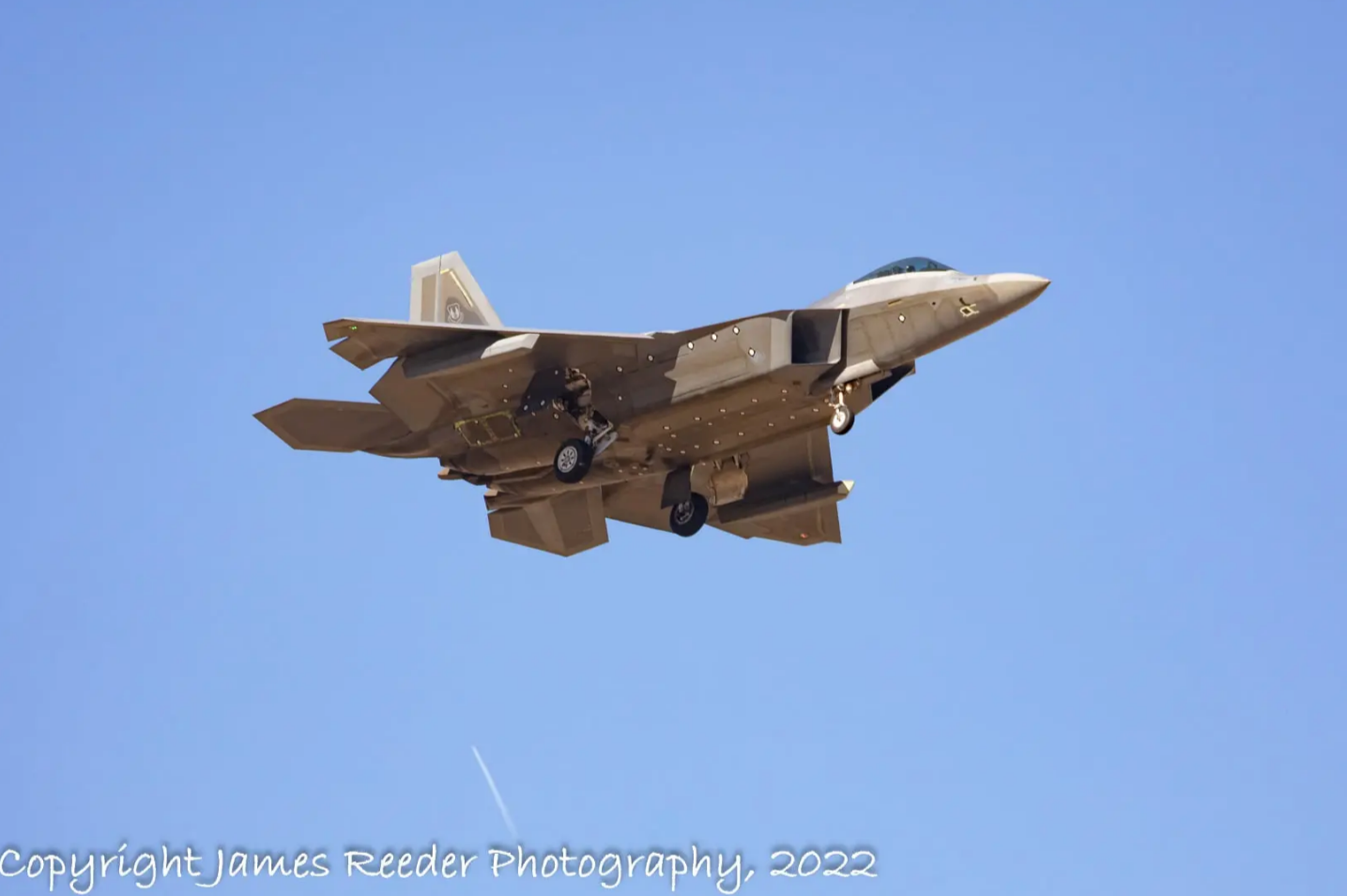 A test F-22 landing at Plant 42 with the same underwing pods as seen in the rendering. (Credit: James Reeder)
