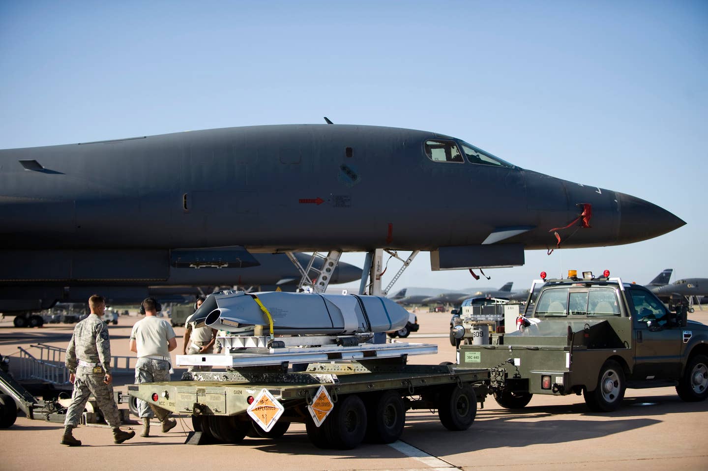 Airmen from the 7th Munitions Squadron transport a Long Range Anti-Ship Missile (LRASM) toward a B-1B at Dyess Air Force Base, Texas. <em>U.S. Air Force photo by Airman 1st Class Damon Kasberg/Released</em><br>