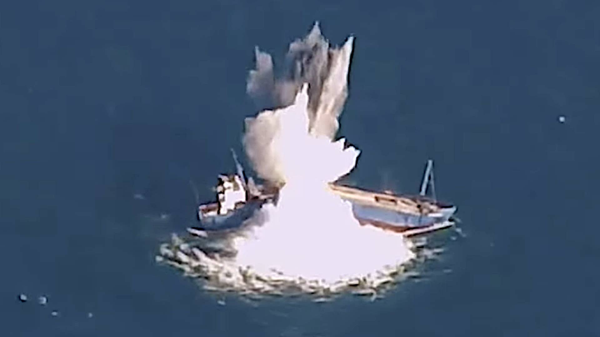 A frame from a video the US Air Force released showing a modified JDAM precision-guided bomb striking a target ship in the Gulf of Mexico during a test in April 2022.