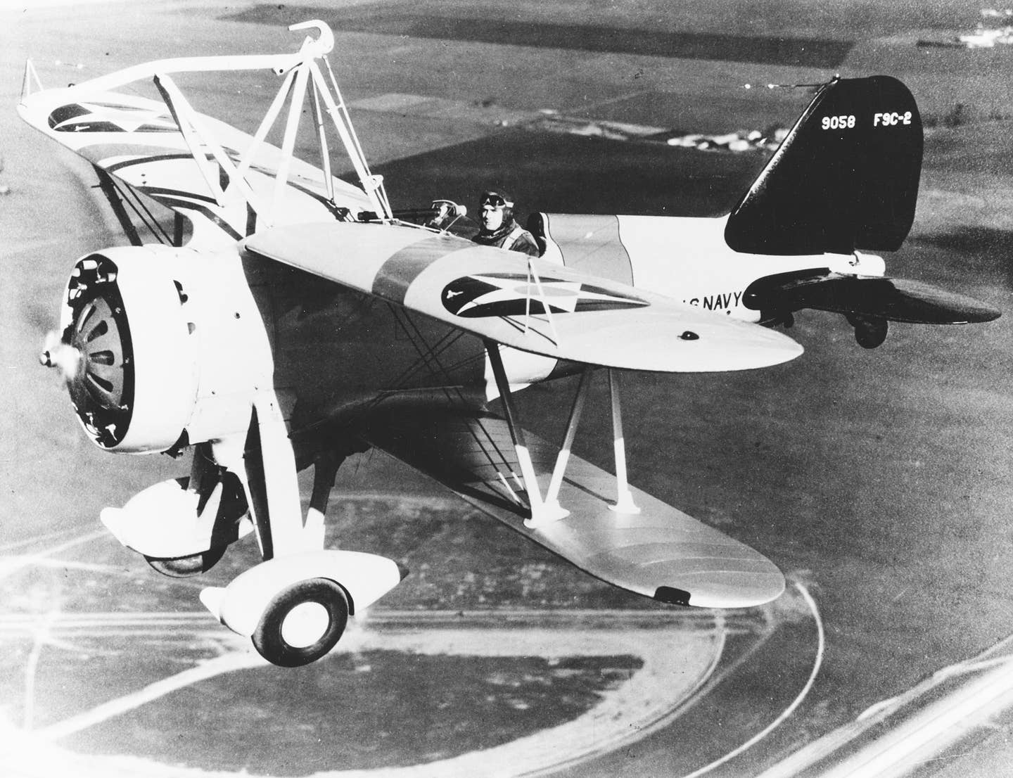 A Curtiss F9C-2 Sparrowhawk fighter, piloted by Lt. Harold B. Miller over Naval Air Station Moffett Field, California, in 1934. <em>U.S. Naval History and Heritage Command</em>