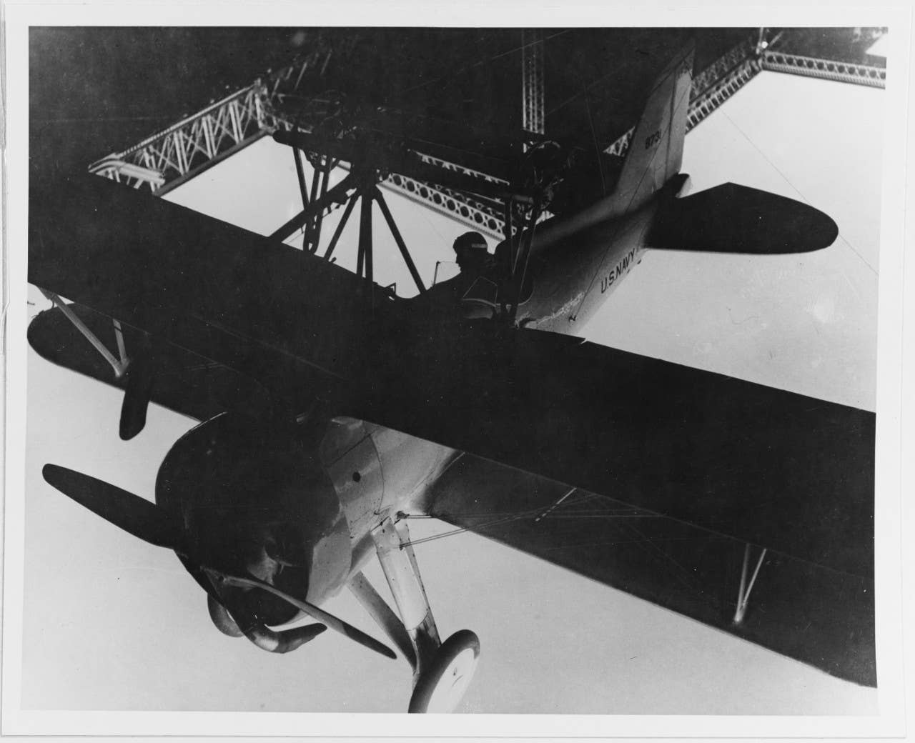 <br>Lt. Howard L. Young in the cockpit of the XF9C-1 Sparrowhawk as the fighter is lifted into the hangar of USS <em>Akron</em>, May 3, 1932. <em>U.S. National Archives</em><br>
