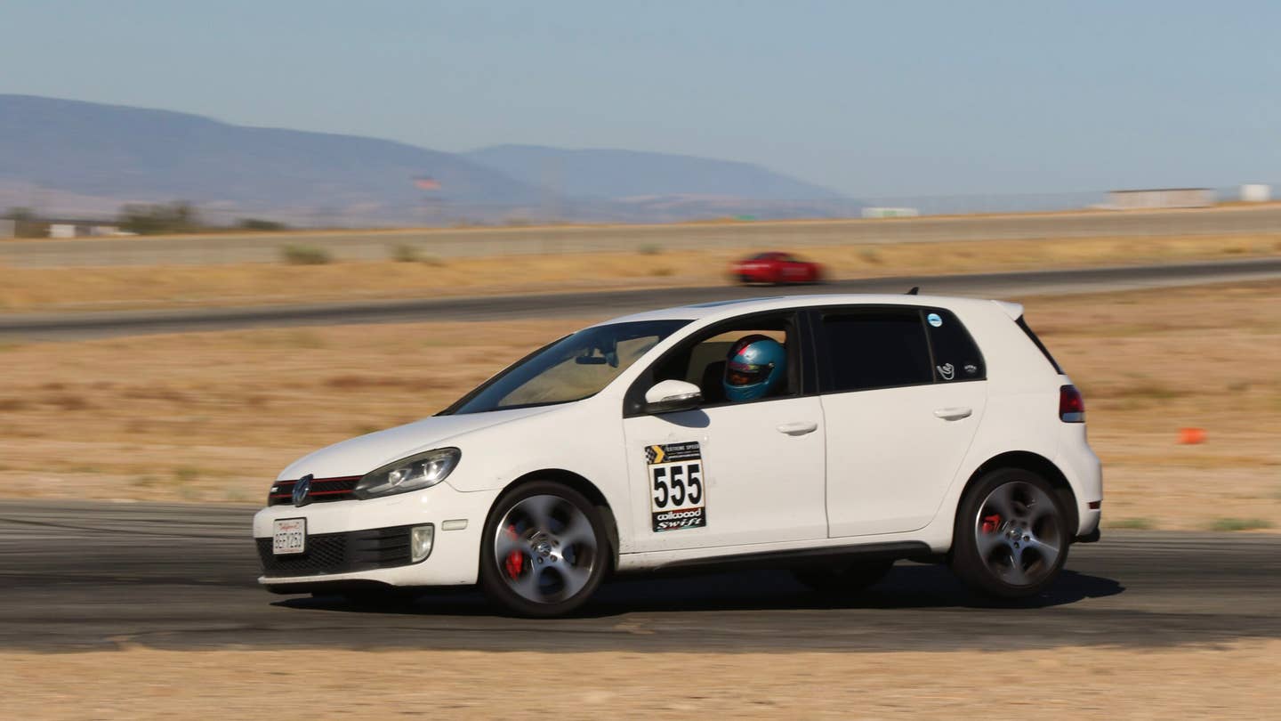 A 2010 GTI oversteering through Turn 11 at Willow Springs Streets Of Willow handling course.