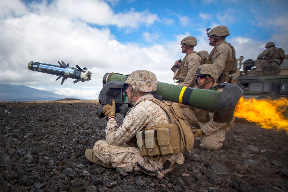 A U.S. Marine fires a Javelin at an enemy tank during Exercise Lava Viper at Pohakuloa Training Area, Hawaii, as part of anti-armor procedure training. <em>U.S. Marine Corps photo by Cpl. Ricky S. Gomez/Released</em>