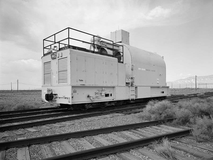 Idaho National Laboratory's radiation-shielded locomotive  against a mountainous backdrop | Library of Congress