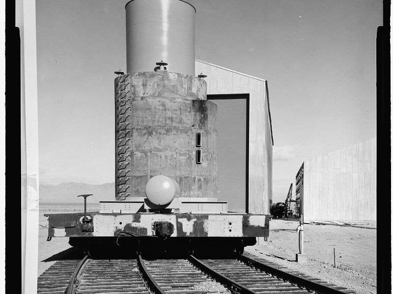 Unknown grain silo-shaped payload aboard double-width flatcar at the Idaho National Laboratory | Library of Congress