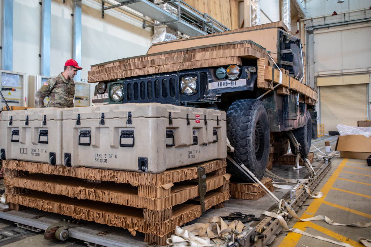 Members of the 173rd Airborne Brigade Combat Team rig up a Humvee for airdrop at&nbsp;Aviano Air Base in Italy on May 10, 2022, as part of preparations for the Swift Response airdrops.