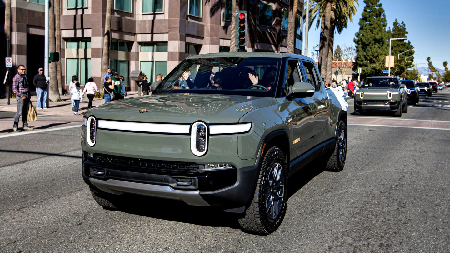 A Rivian R1T on the road.