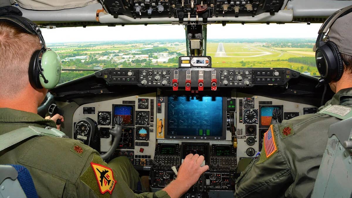 A view from inside the cockpit of a Block 45 KC-135R during a laind approach. The wide-area digital multi-function display in the center of the cockpit is another key feature of the upgrade package.
