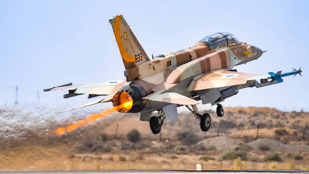 An Israeli Air Force F-16I "Sufa" Fighting Falcon takeoff with full power afterburner. <em>Wiki Commons by Nehemia Gershuni-Aylho</em>
