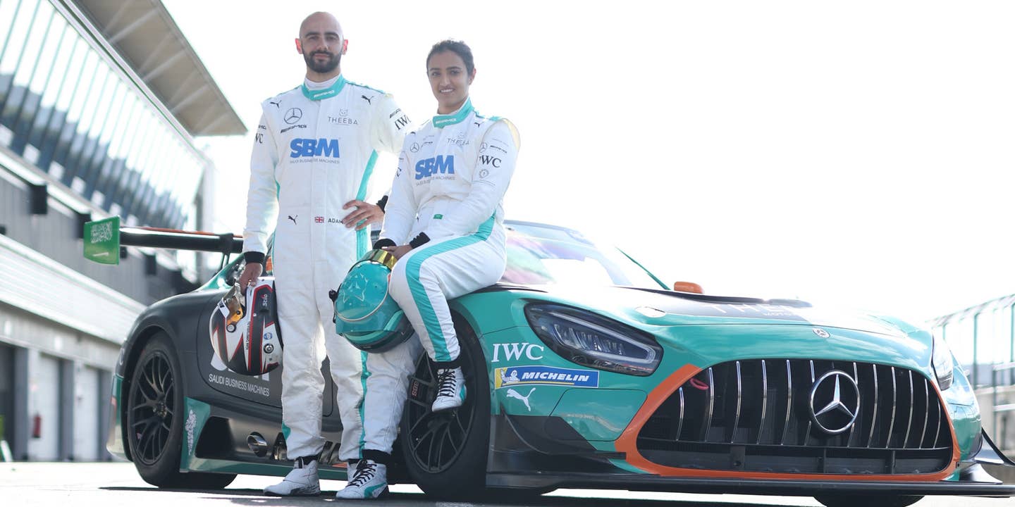 Reema Juffali and Adam Christodoulou standing next to the Theeba racing AMG GT3 car