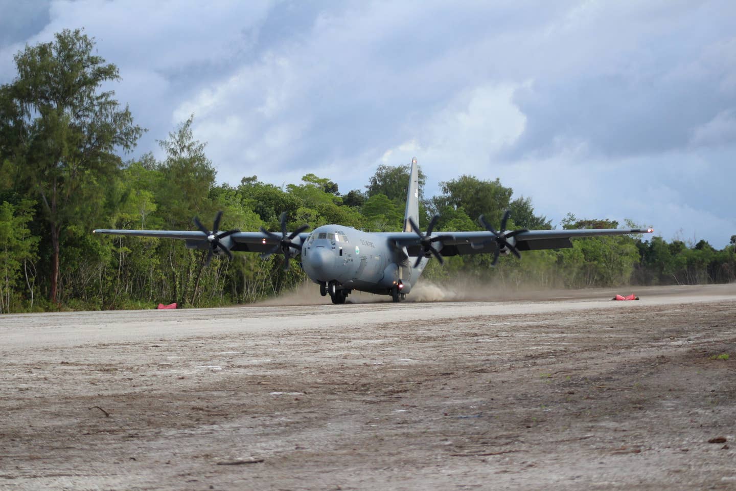 A U.S. Air Force C-130J delivers soldiers onto the newly renovated Angaur Airfield for training exercises in the Republic of Palau, September 2020. <em>US Army</em>