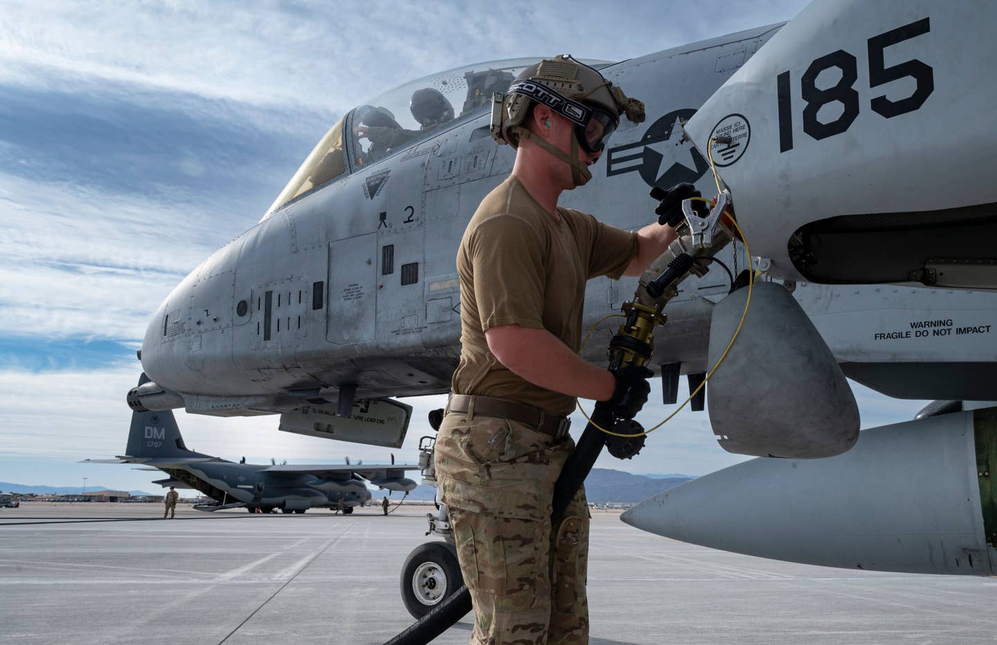 A Forward Area Refueling Point (FARP) operator assigned fuels up an A-10C Thunderbolt II during Black Flag 22-1 at Nellis AFB, May 10, 2022. <em>U.S. Air Force photo by William R. Lewis</em>