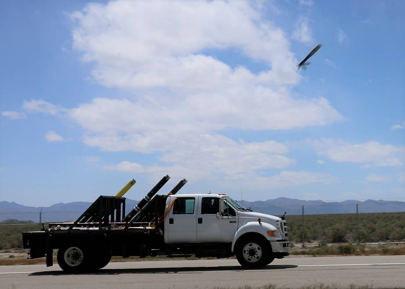 A truck with multiple ALE launchers sends a drone skyward during EDGE 22. <em>U.S. Army</em>