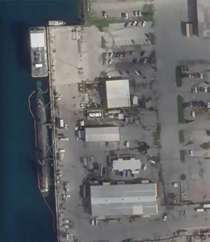A satellite image showing USS <em>Connecticut</em> pierside in Guam following the accident on Oct. 20, 2021. <em>PHOTO © 2021 PLANET LABS INC. ALL RIGHTS RESERVED. REPRINTED BY PERMISSION</em>