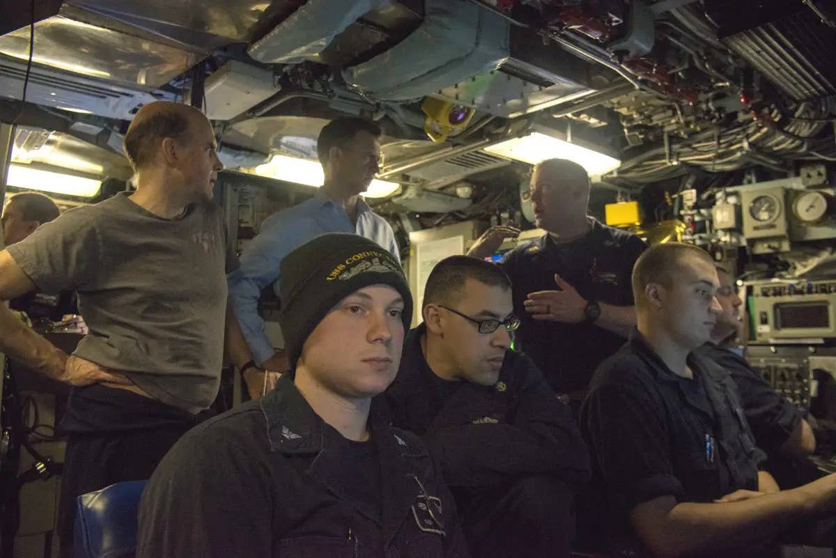 A picture showing sailors working onboard the USS <em>Connecticut</em> from years before the accident. <em>USN</em>