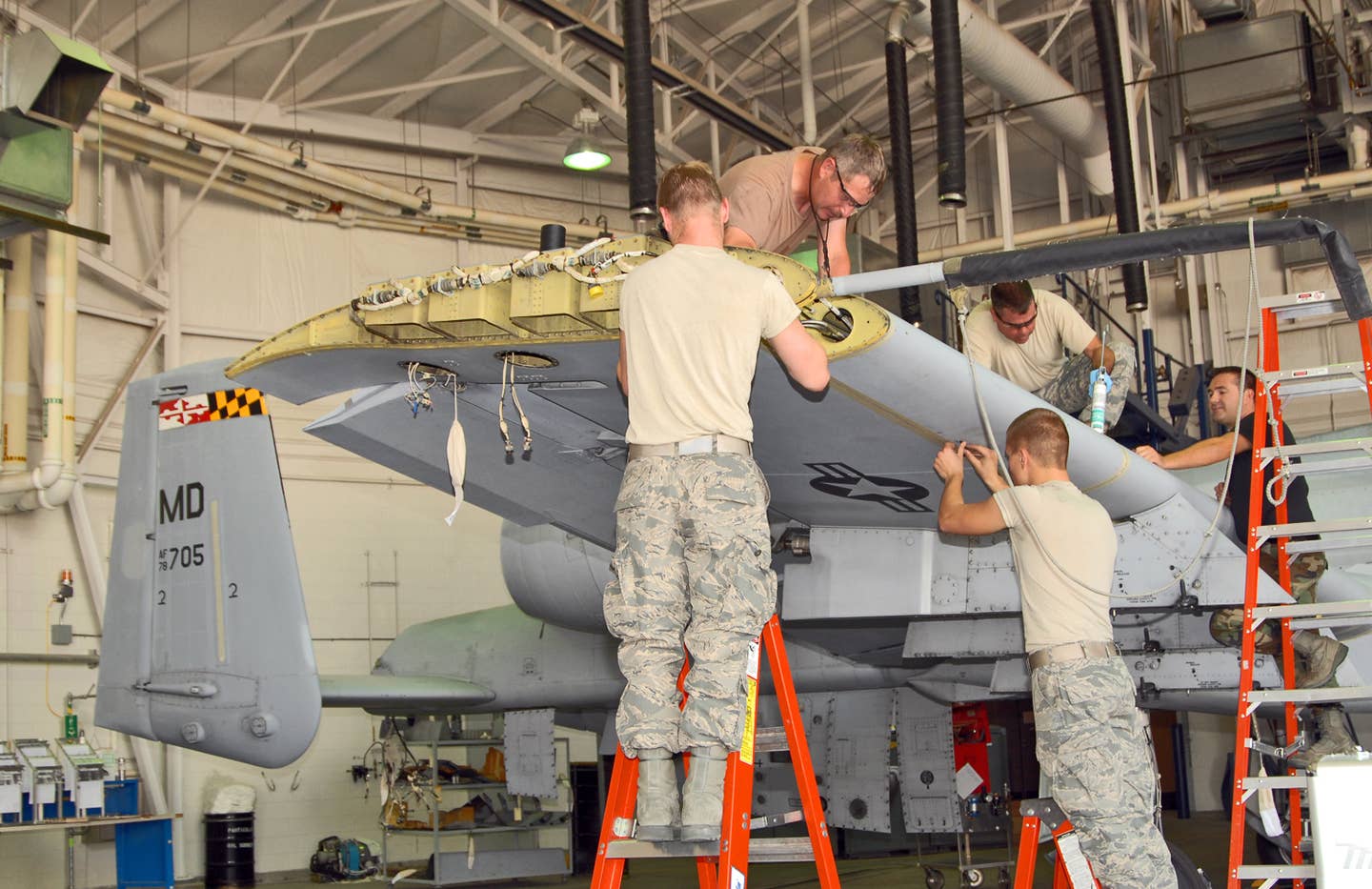A team of Idaho Air National Guard maintainers from the 124th Wing at Gowen Field in Boise, Idaho reinstall the leading edges on the wing of a Maryland Air National Guard A-10 Thunderbolt II. (U.S. Air Force photo/Master Sgt. Thomas Gloeckle)