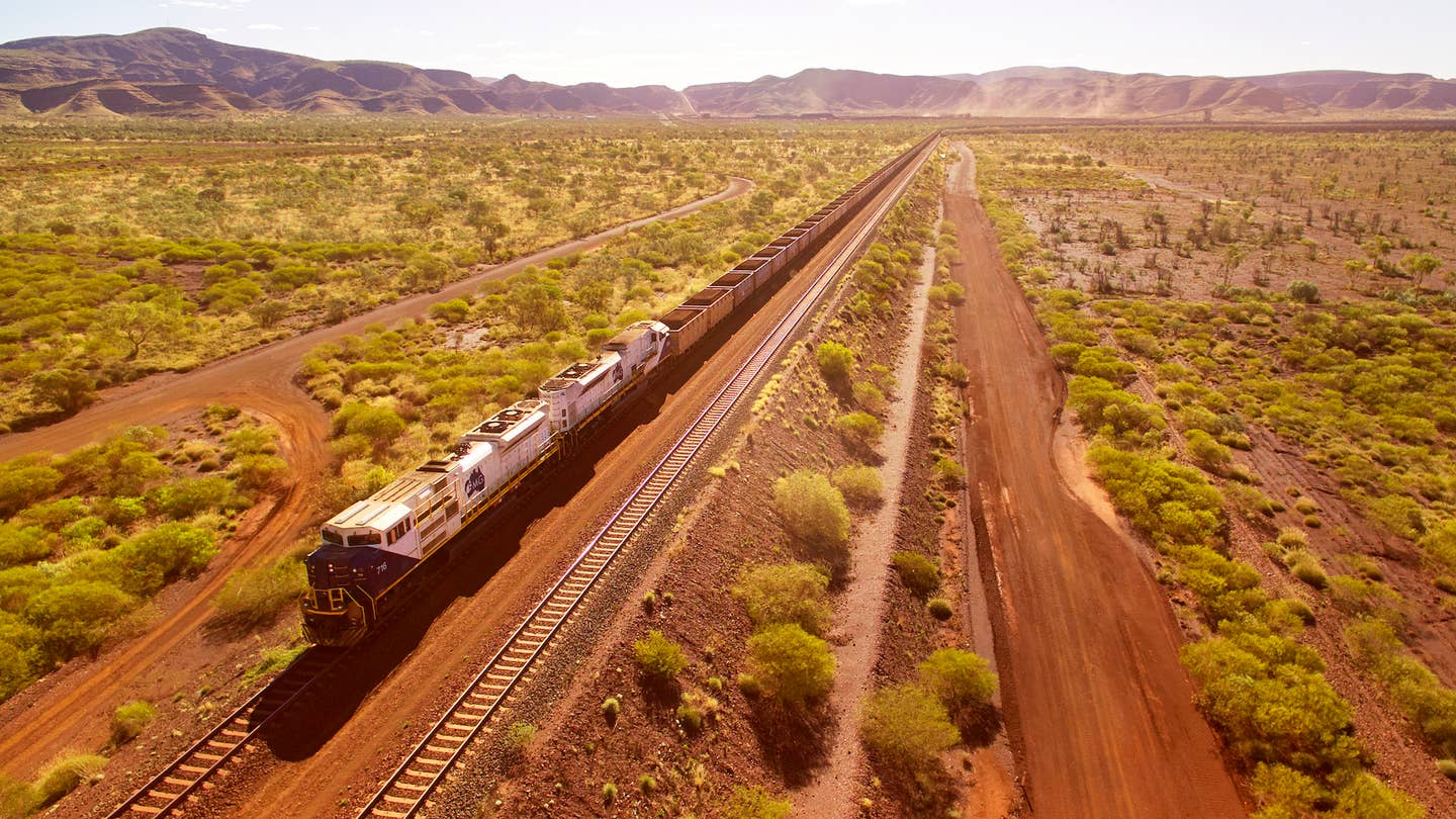 A Fortescue mining train traverses the Australian outback, as seen from above