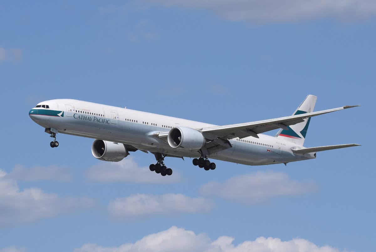 A Cathay Pacific Boeing 777-300ER on approach to London's Heathrow Airport. <em>Adrian Pingstone via Wikimedia</em>