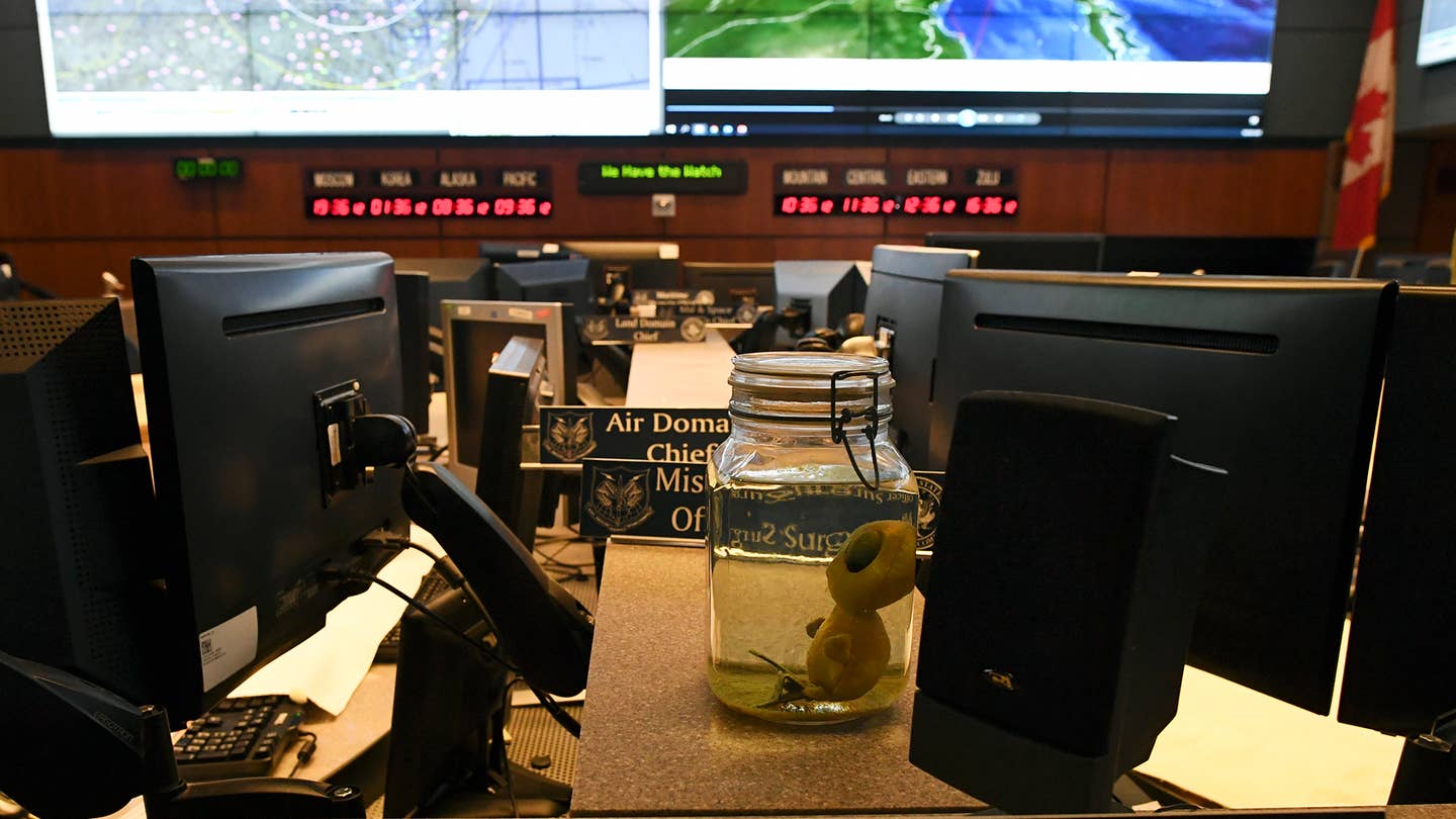 COLORADO SPRINGS, CO - MAY 10: A small group of media were allowed an inside look at the command center at Cheyenne Mountain Air Force Station on May 10, 2018 in Colorado Springs, Colorado. As a part of an on going joke the command center has stuffed alien doll in a jar placed in front of the director's desk. NORAD celebrates its 60th Anniversary at Cheyenne Mountain Air Force Station. (Photo by RJ Sangosti/The Denver Post via Getty Images)