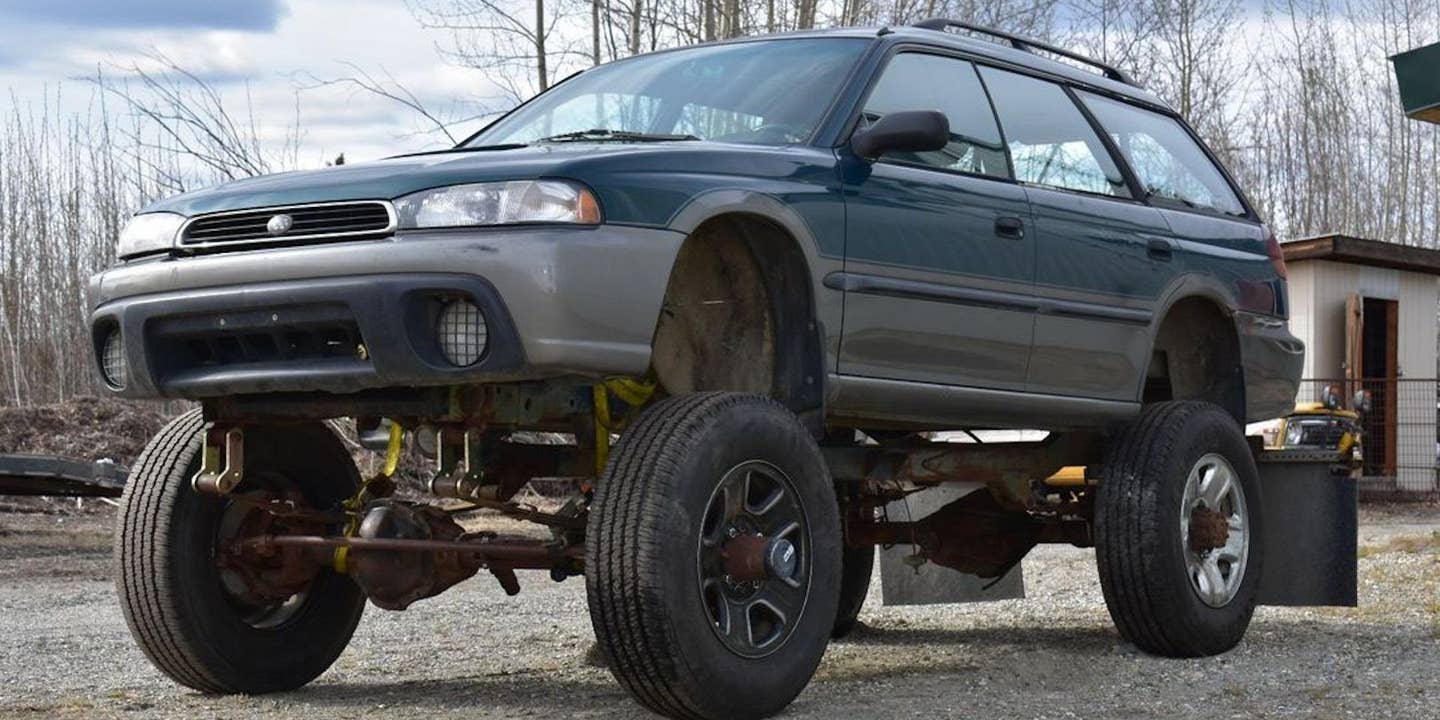 Solid-axle Subaru Outback on an extended Jeep frame