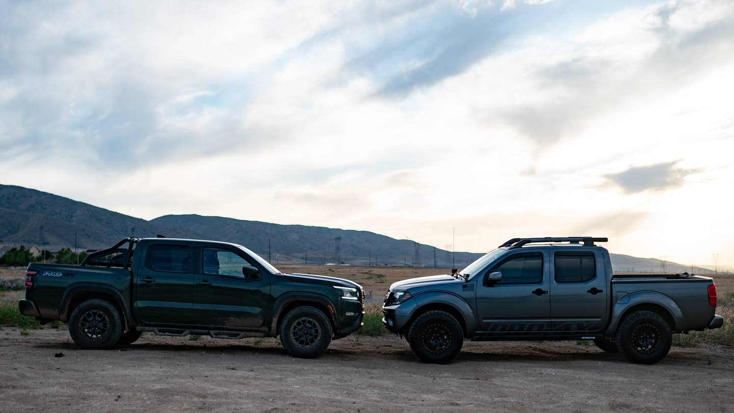 The 2022 Nissan Frontier and the 2020 Frontier facing each other head on. The 2022 is green and the 2020 is metallic gray.