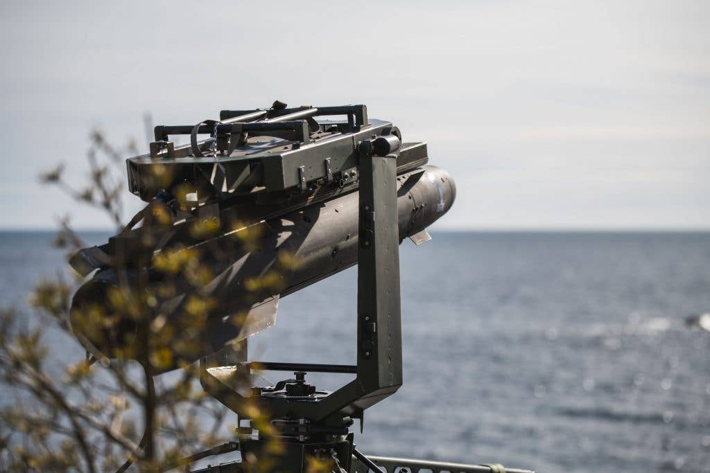 Robot 17 missile loaded onto the launcher. <em>Swedish Armed Services</em>
