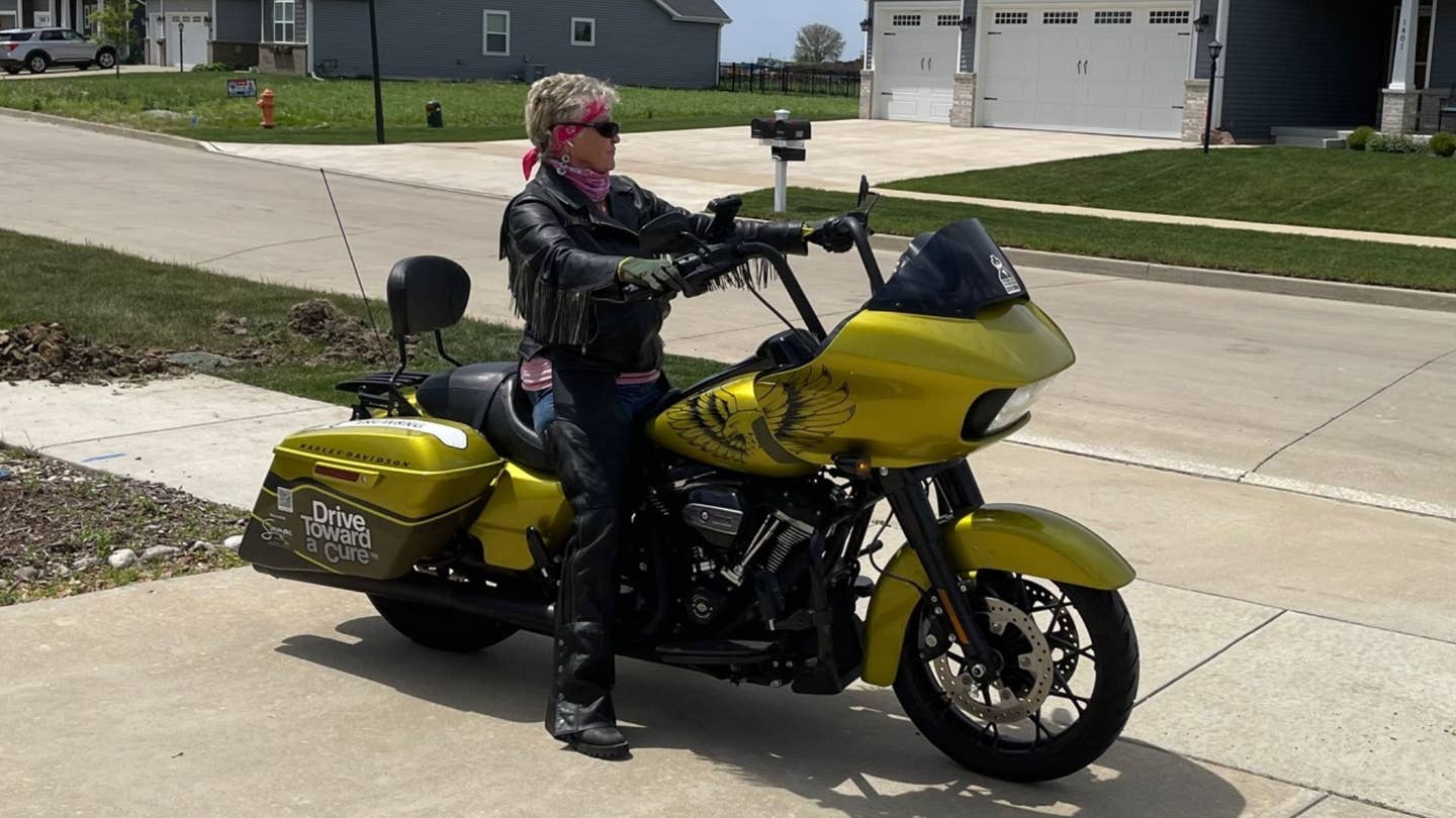Woman on yellow motorcycle