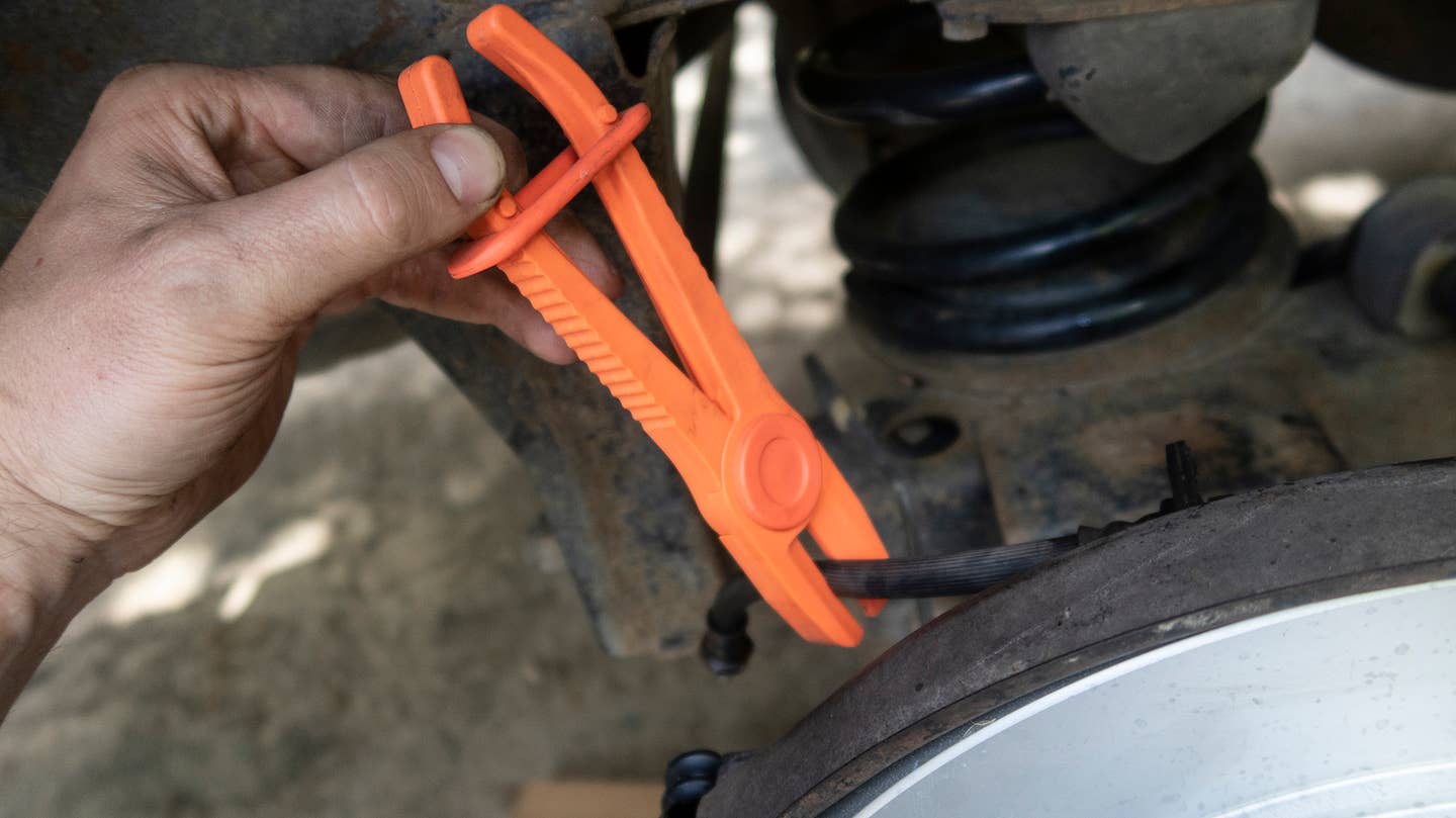 Brake hose clamping tool