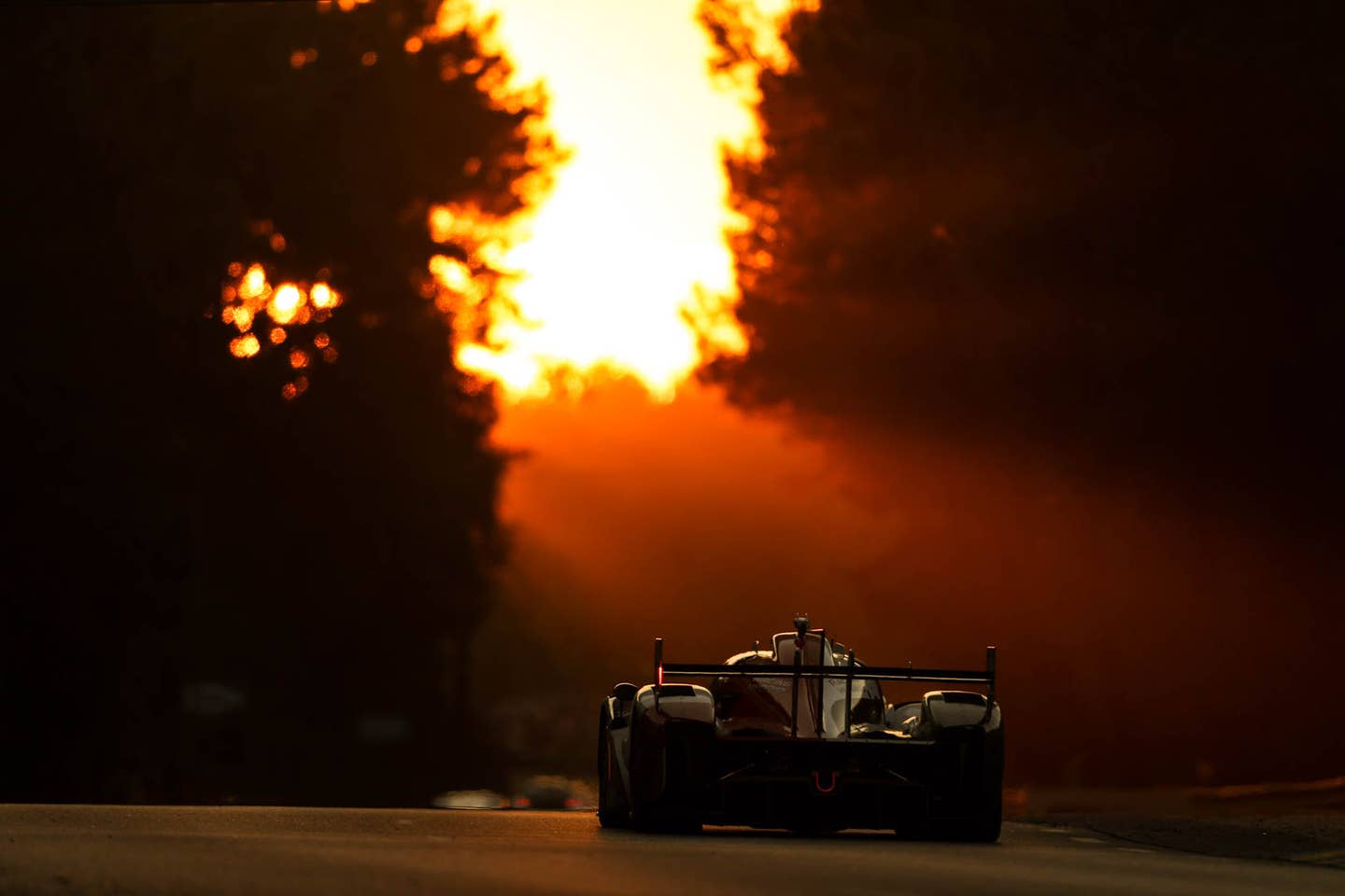 LE MANS, FRANCE - JUNE 12: The #08 Toyota Gazoo Racing GR010 Hybrid of Sebastien Buemi, Brendon Hartley, and Ryo Hirakawa in action at sunrise at the Le Mans 24 Hours Race on June 12, 2022 in Le Mans, France. (Photo by James Moy Photography/Getty Images)