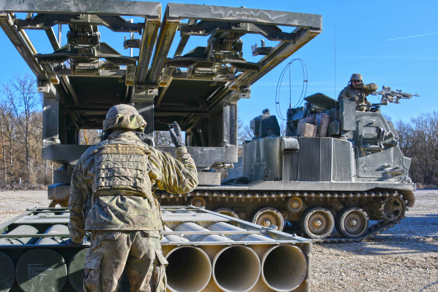 U.S. Soldiers load an M270 Multiple Launch Rocket System at Grafenwoehr Training Area, Germany, in March. <em>U.S. Army photo by Gertrud Zach</em>