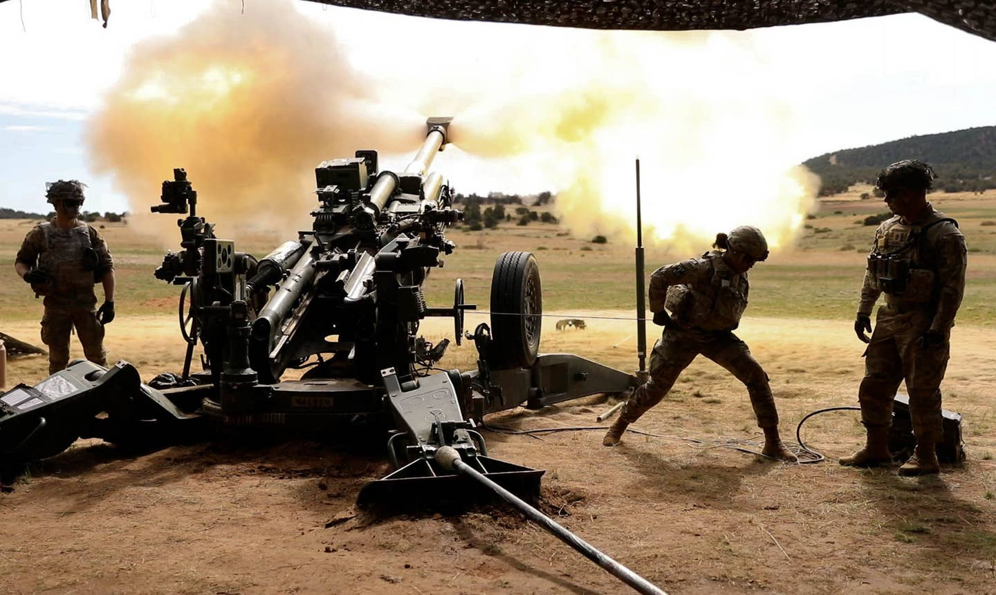 U.S. soldiers fire an M777 howitzer at Fort Carson, Colorado. <em>U.S. Army photo by Pfc. Joshua Zayas</em>