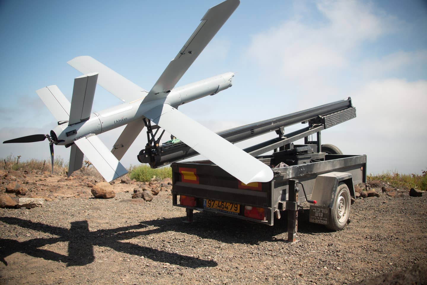 A Hero-400 sits on a trailer-mounted launcher during a test in 2022 where Marines flying in a UH-1Y helicopter took control of the loitering munition after its launch. <em>USMC</em>
