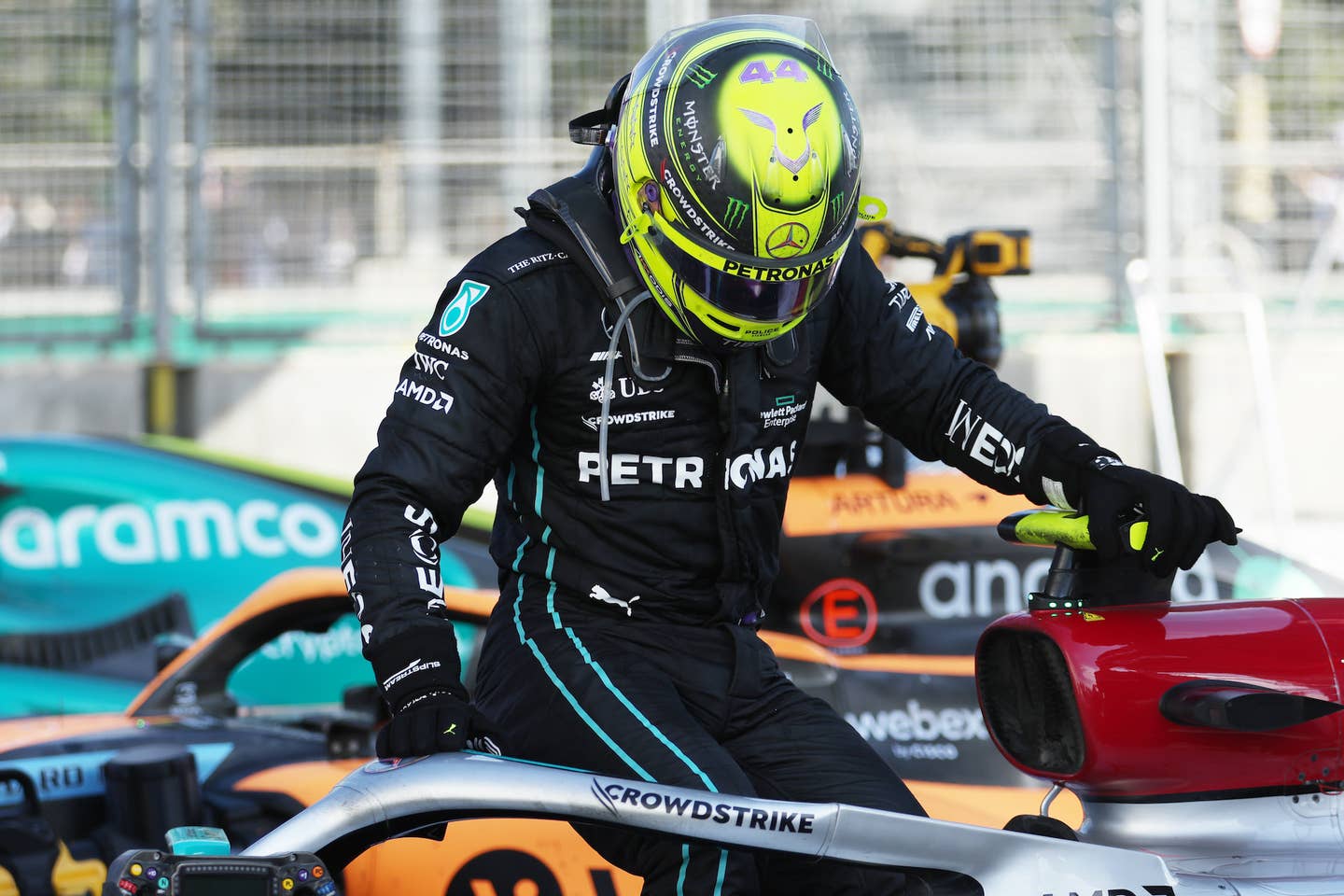 BAKU, AZERBAIJAN - JUNE 12: Fourth placed Lewis Hamilton of Great Britain and Mercedes climbs from his car after complaining of pain during the F1 Grand Prix of Azerbaijan at Baku City Circuit on June 12, 2022 in Baku, Azerbaijan. (Photo by Bryn Lennon - Formula 1/Formula 1 via Getty Images)