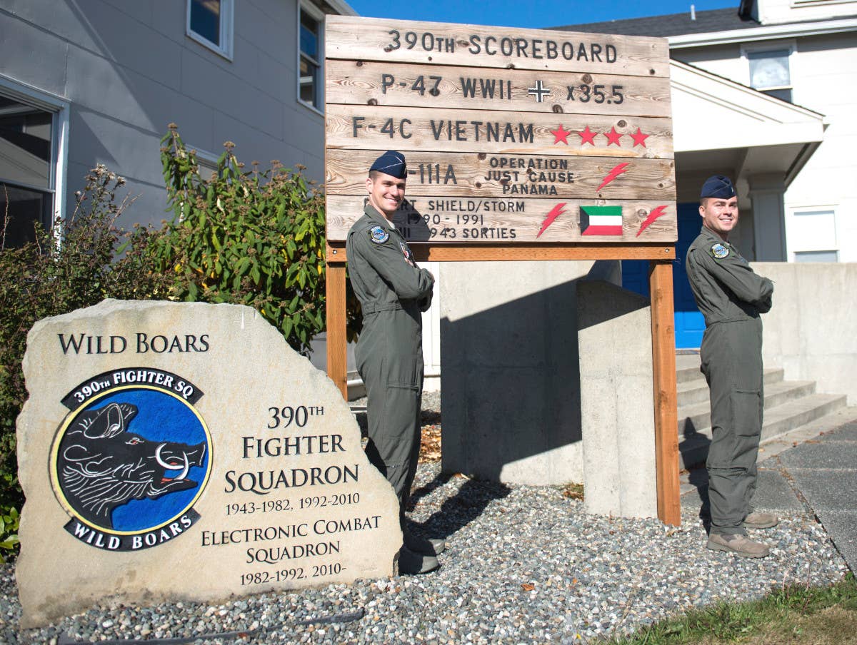 Members of the 390th Electronic Combat Squadron – a unit that was actually equipped with EF-111As between 1982 and 1992 – stand in front of the unit's offices at Naval Air Station Whidbey Island in Washington State in 2017. <em>USAF / Airman 1st Class Jeremy D. Wolff</em>