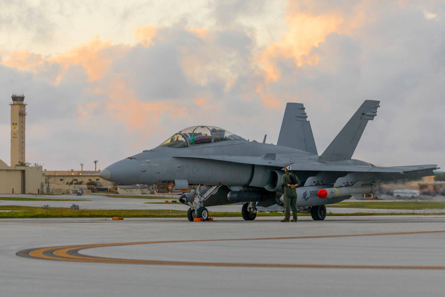 Armed with Harpoon anti-ship missiles, a U.S. Marine Corps F/A-18D Hornet prepares to take off from Andersen Air Force Base Guam, on June 14, 2022, to participate in Valiant Shield 22. <em>U.S. Marine Corps photo by Cpl. Tyler Harmon</em>
