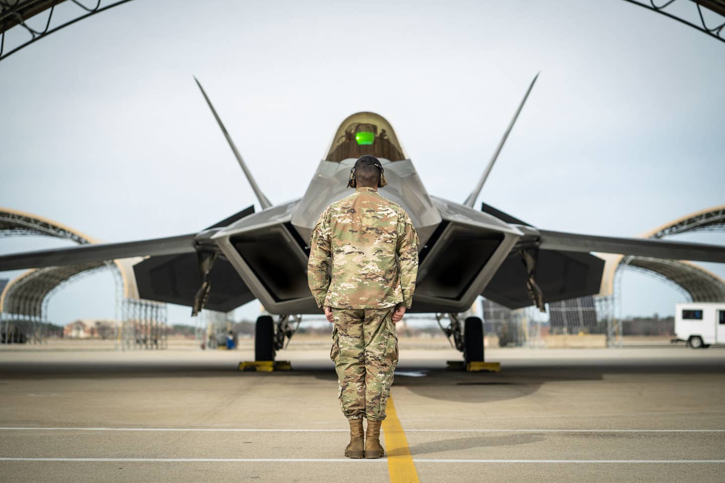 A Raptor assigned to the F-22 Demo Team prepares to be launched by a crew chief at Joint Base Langley-Eustis, Virginia. <em>U.S. Air Force photo by 2nd Lt. Sam Eckholm</em>