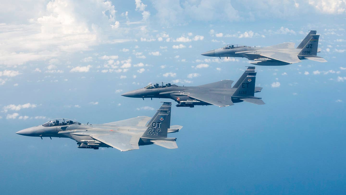 U.S. Air Force Gen Mark Kelly, Commander of Air Combat Command, leads a three-ship formation of F-15s from the 53rd Wing near Eglin Air Force Base, Florida. Nearest the camera is an F-15EX, followed by an F-15E Strike Eagle and an F-15C. <em>U.S. Air Force photo by Tech. Sgt. John Raven</em>
