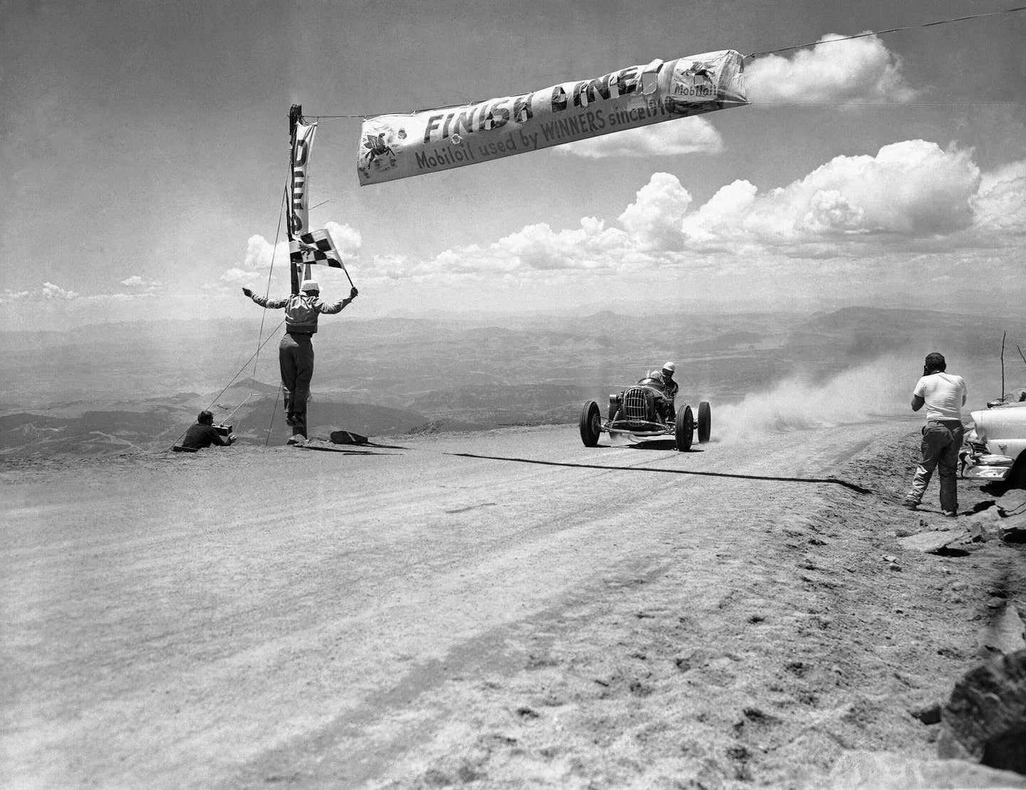 Bobby Unser crosses the finish line to win the 1956 Pikes Peak International Hill Climb | AP Photo
