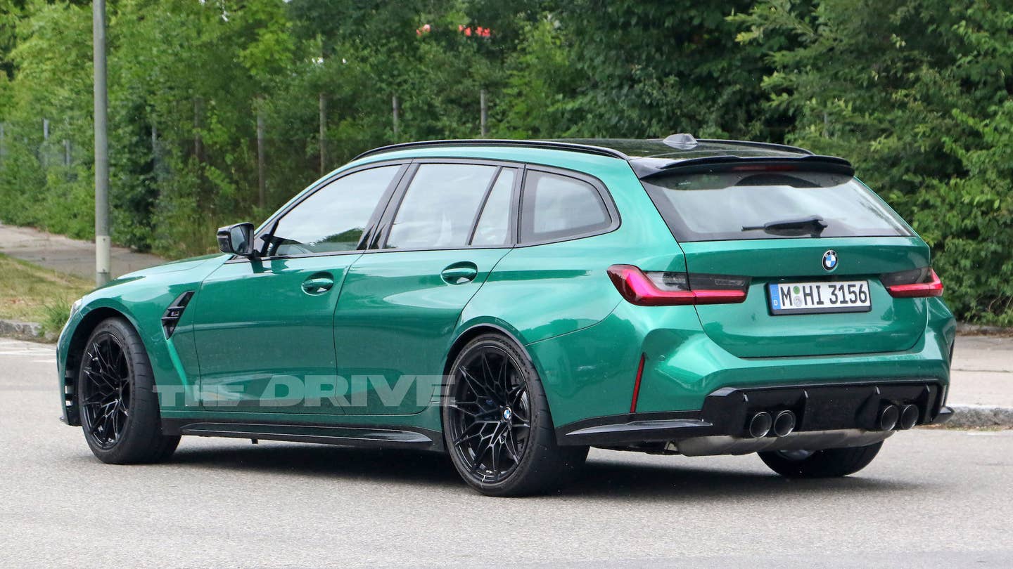 Rear 3/4 view of a green BMW M3 Touring.