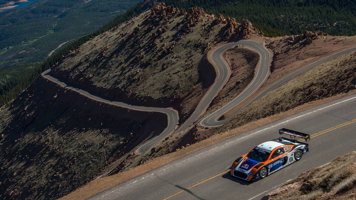 Rhys Millen, the current record holder with 9m46.164 tries out his Hyundai Genesis to the top of Pikes Peak mountain as he prepares for the June 30 Pikes Peak International Hill Climb (PPIHC) at Pike National Forest, 10 miles (16 km) west of Colorado Springs, Colorado, on June 9, 2013.  The mountain is not only a national landmark but is also home of The Pikes Peak International Hill Climb (PPIHC), also known as The Race to the Clouds, an annual automobile and motorcycle hillclimb to the summit of Pikes Peak. The track measures 12.42 miles (19.99 km) over 156 turns, climbing 4,720 ft (1,440 m) from the start at Mile 7 on Pikes Peak Highway, to the finish at 14,110 ft (4,300 m), on grades averaging 7 percent.