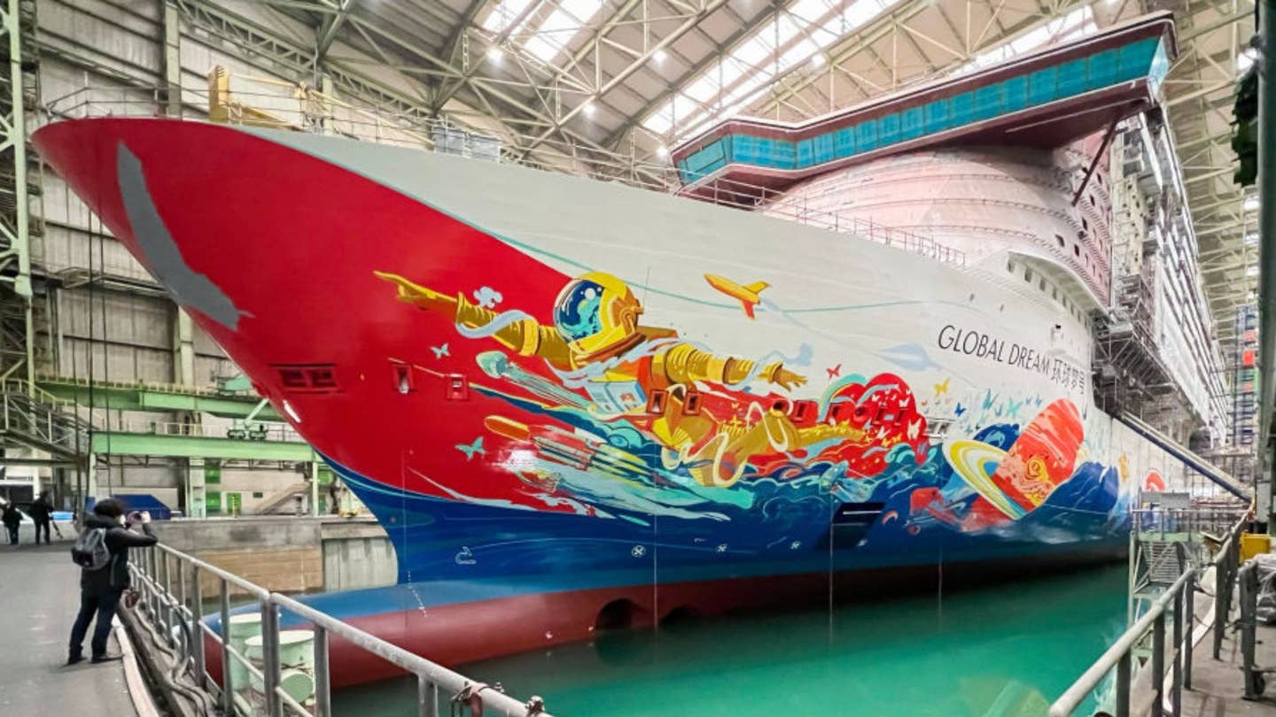Colorful painted cruise ship with red hull
