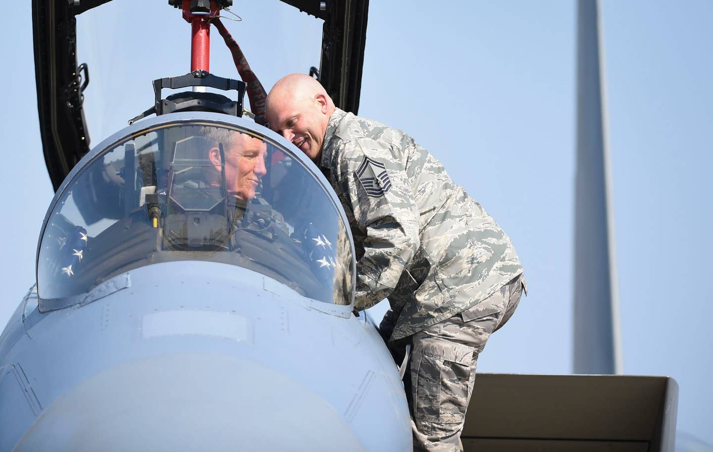 U.S. Air Force Gen. Herbert “Hawk” Carlisle, commander of Air Combat Command, goes over a preflight maintenance check in an F-15C at Joint Base Langley-Eustis, Virginia, in 2017. <em>U.S. Air Force photo/Staff Sgt. Natasha Stannard</em>