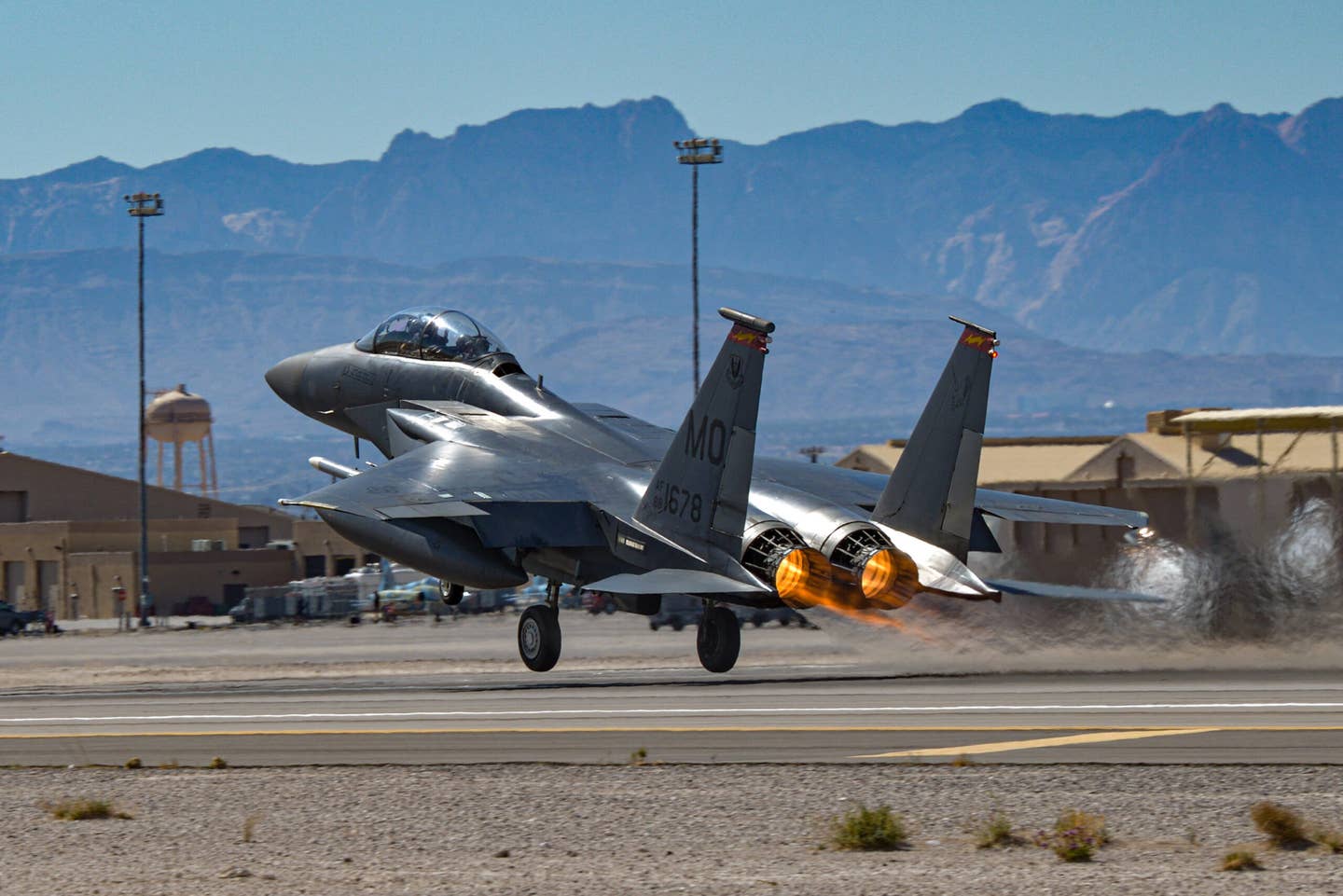 A U.S. Air Force F-15E from Mountain Home Air Force Base, Idaho, lifts off for the Nevada Test and Training Range during Red Flag-Nellis 22-2 at Nellis Air Force Base, Nevada, March 9, 2022. <em>U.S. Air Force photo by Staff Sgt. Austin Siegel</em>