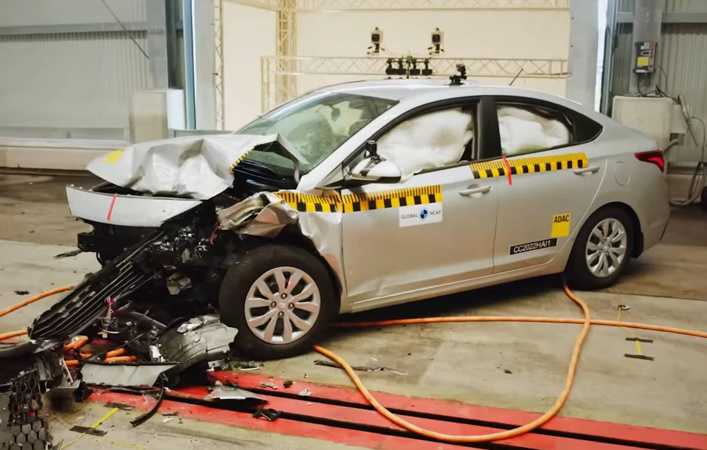 While the US market Hyundai Accent also shows heavy front-end damage, the occupant area is more intact, with the passengers inside much less likely to be seriously harmed.